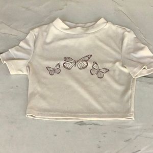 Cream color crop top with brown butterfly